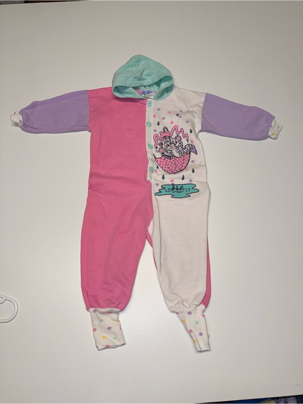 Vintage little gem romper multi color with a cute design made in Canada